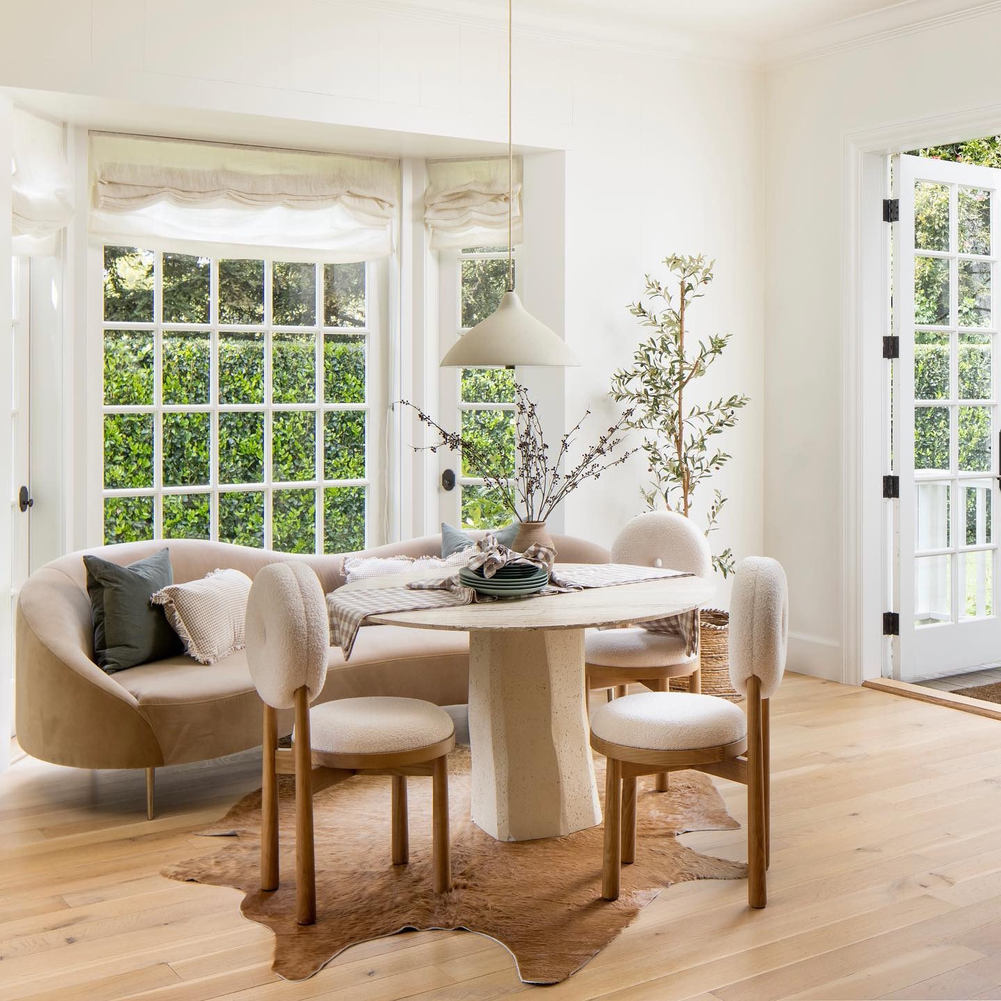 Round Pedestal Table With Textured White Stone-Like Surface