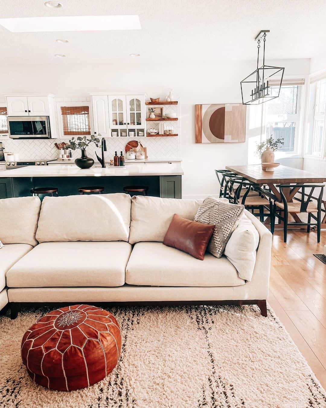 Sectional Sofa with Cognac Leather Pouf and Wishbone Chairs