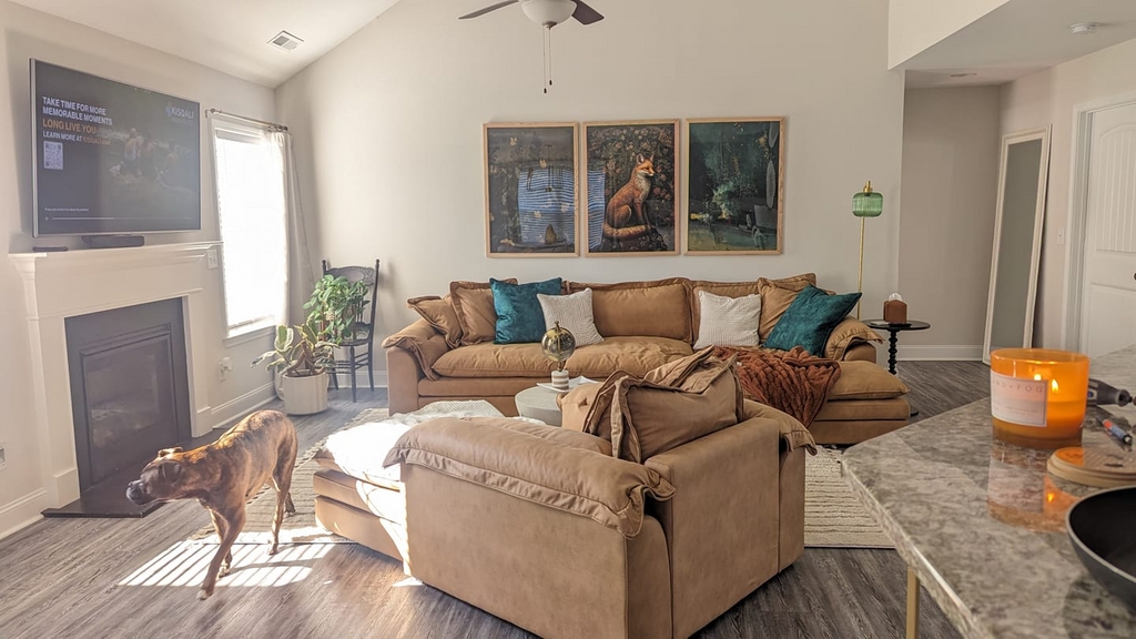 Sectional Sofa with Fox Art Triptych and Teal Pillows