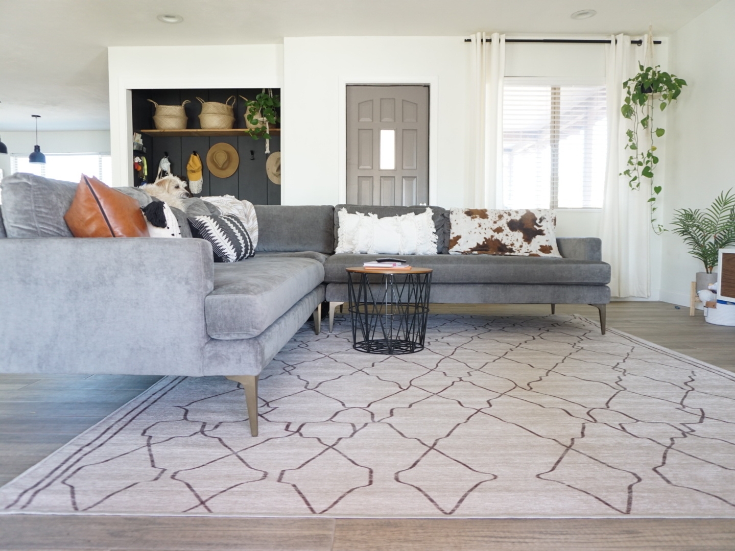 Sectional Sofa with Geometric Lattice Rug and Wire Coffee Table