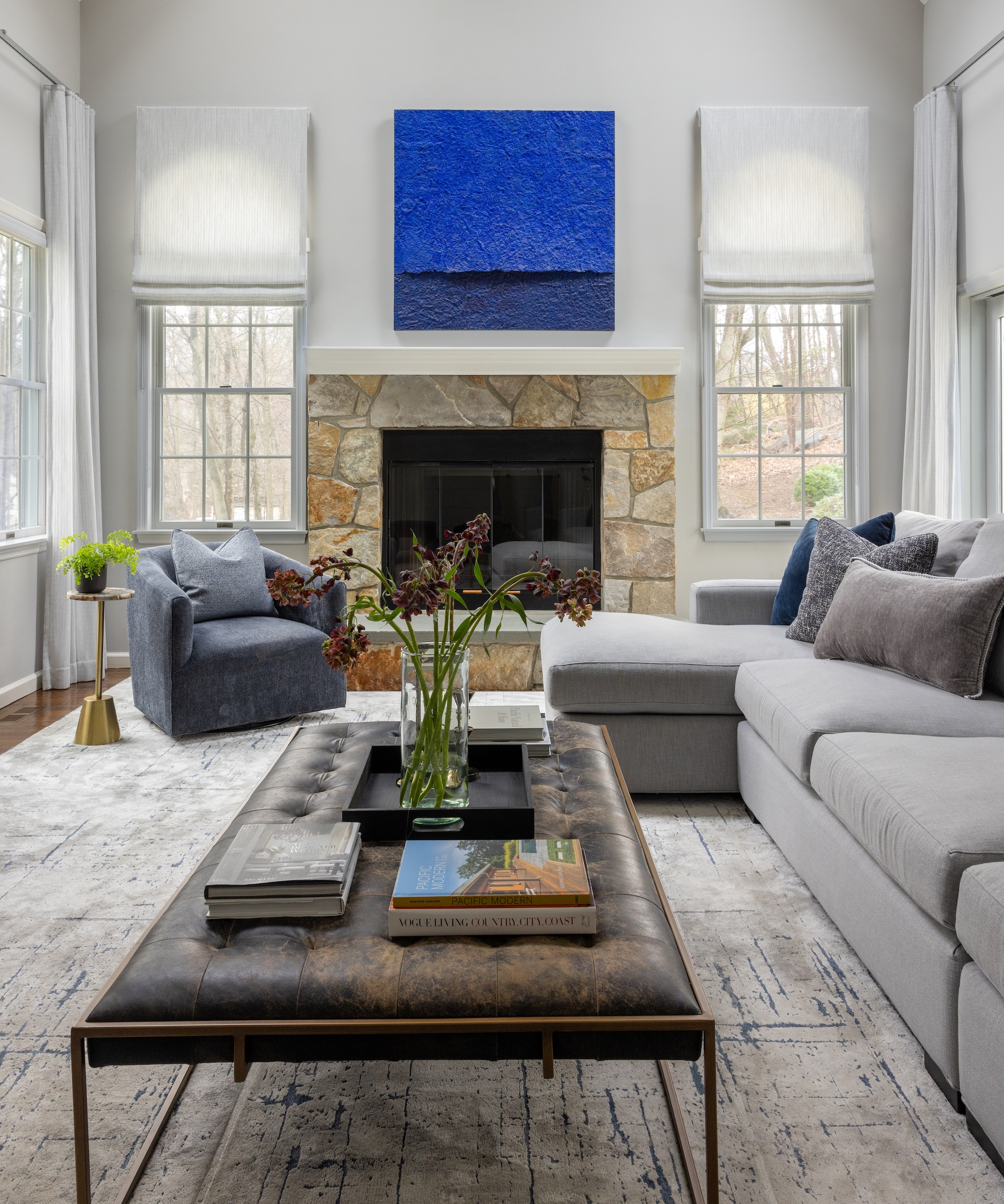 Sectional Sofa with Tufted Leather Table and Blue Art Decor