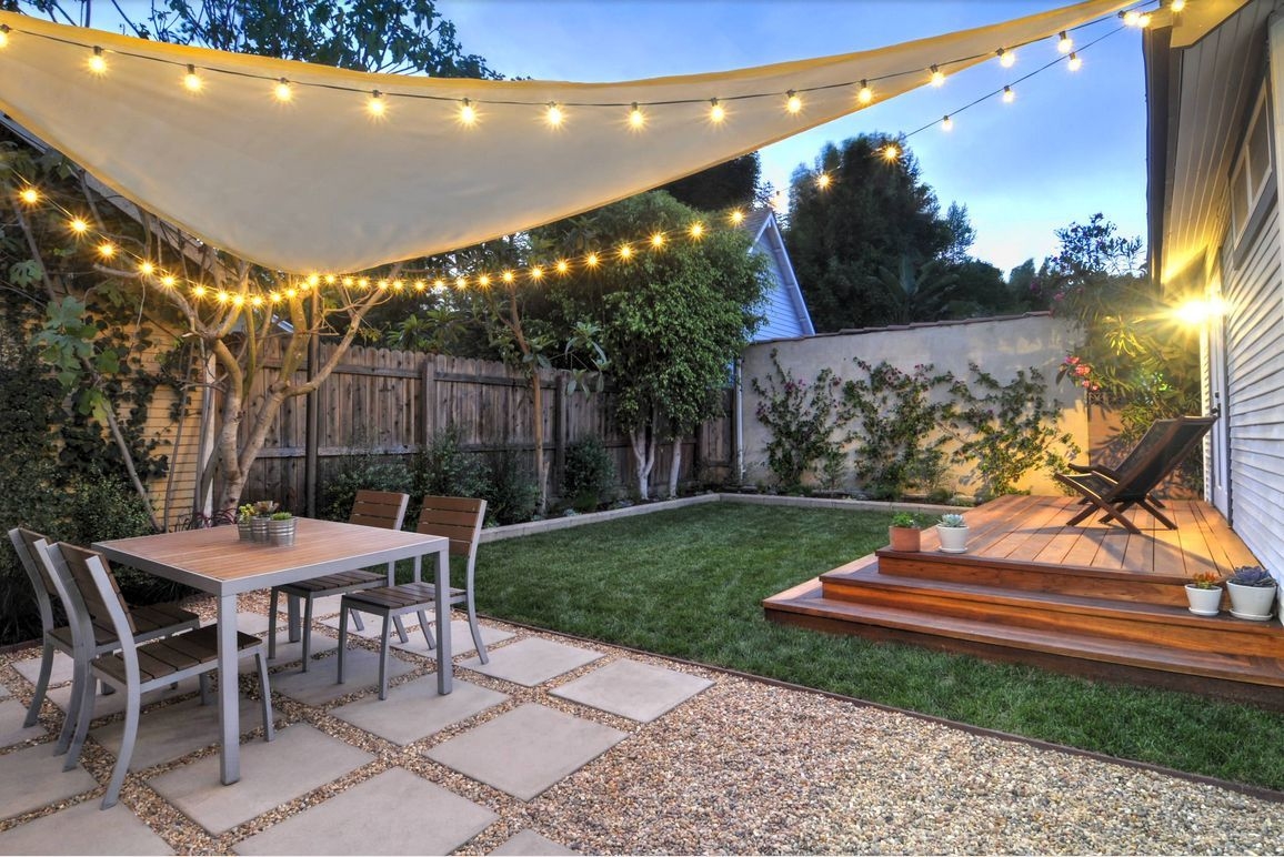 Shade Sail Cream Globe Light Paver and Gravel Patio