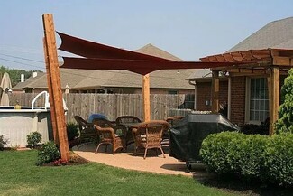 Shade Sail Overlapping Terracotta Timber Post Design
