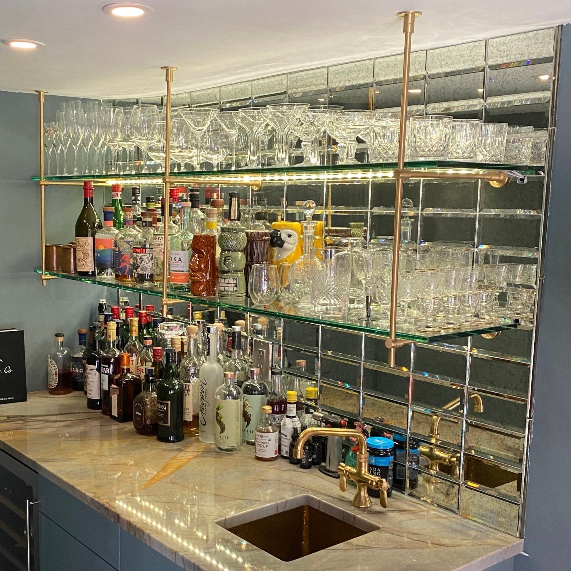 Shelving Unit with Beveled Mirror Backsplash and Custom Brass Bar