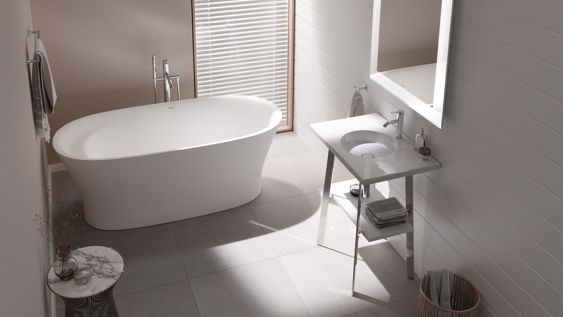 Sleek Freestanding Bathtub with Slender Metal Legs and Basin