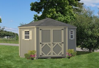 Storage Shed with cross-buck doors and traditional tan trim