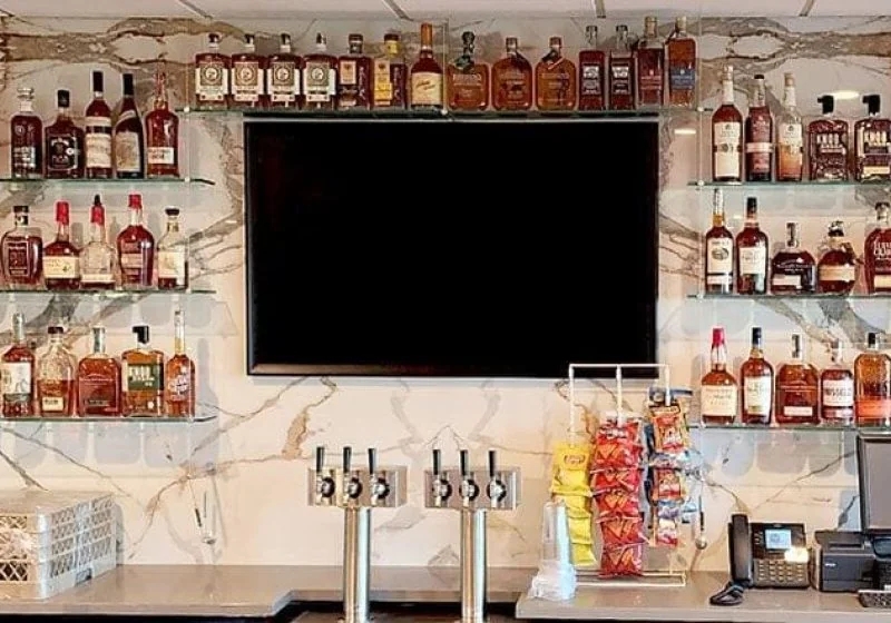 Suspended Glass Shelves with Rod Hanging System and Marbled Backdrop