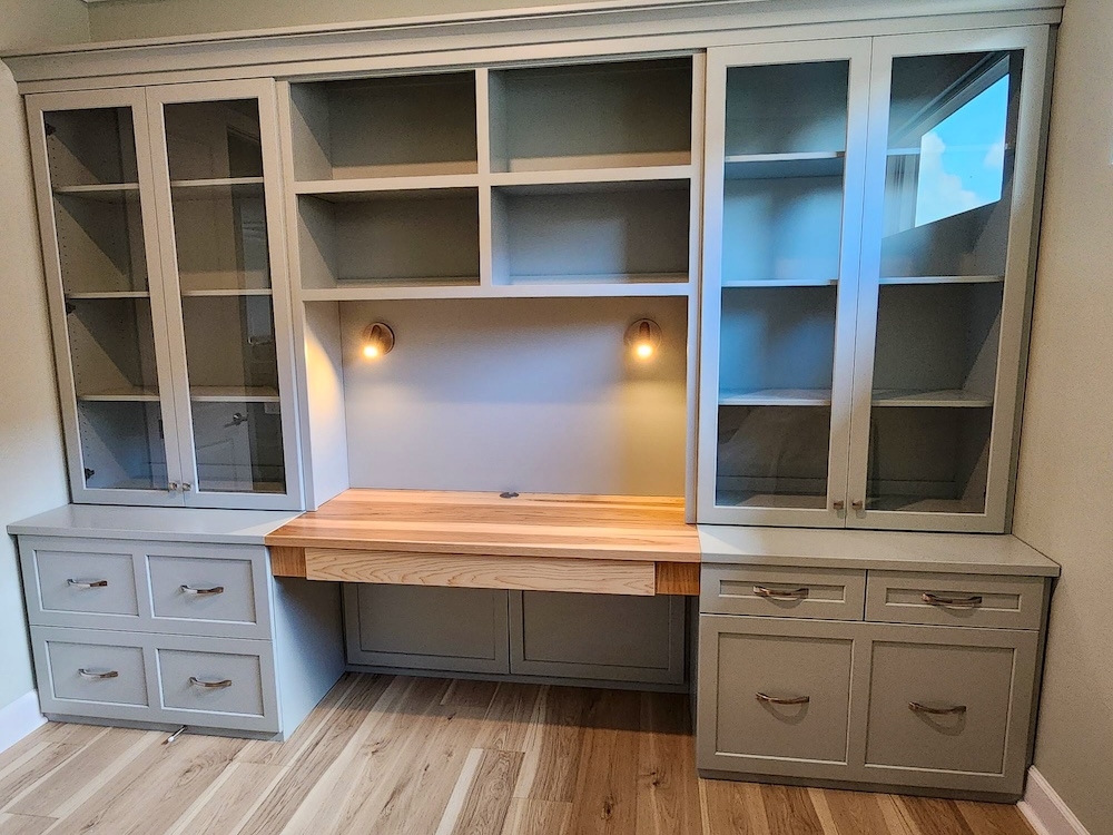 Wall Unit Desk featuring Sage Green Cabinetry and Glass Doors