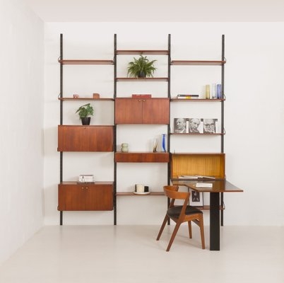 Wall Unit with Black Metal Uprights and Hidden Desk System