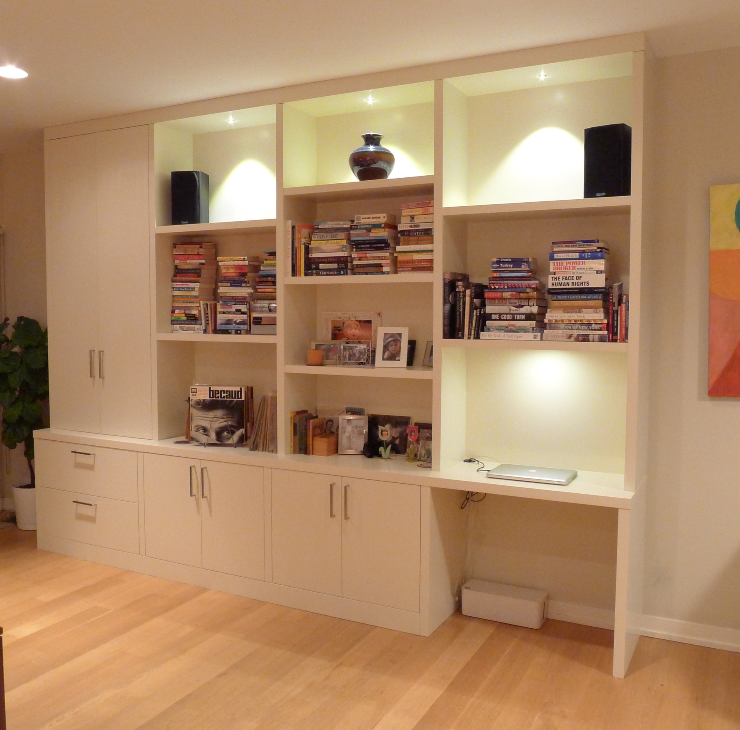 Wall Unit with Recessed Lighting and Floor to Ceiling Storage