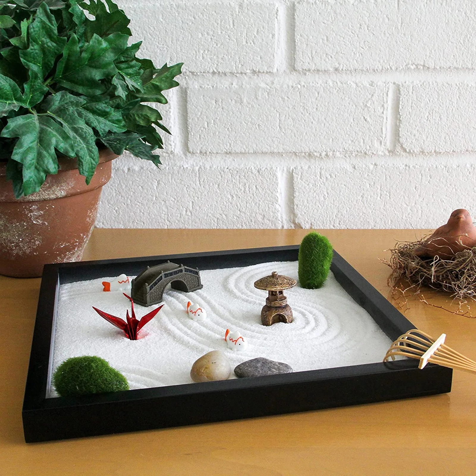 Zen Garden Raked Sand Patterns With Red Origami Crane