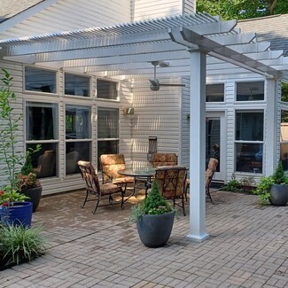 Attached Pergola with Integrated Fan and White Louvered Roof
