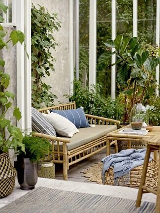 Bamboo Sofa Spindle Construction and Boho Sunroom Decor