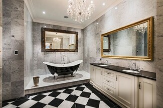 Bathroom Chandelier with Checkerboard Floor and Black Tub