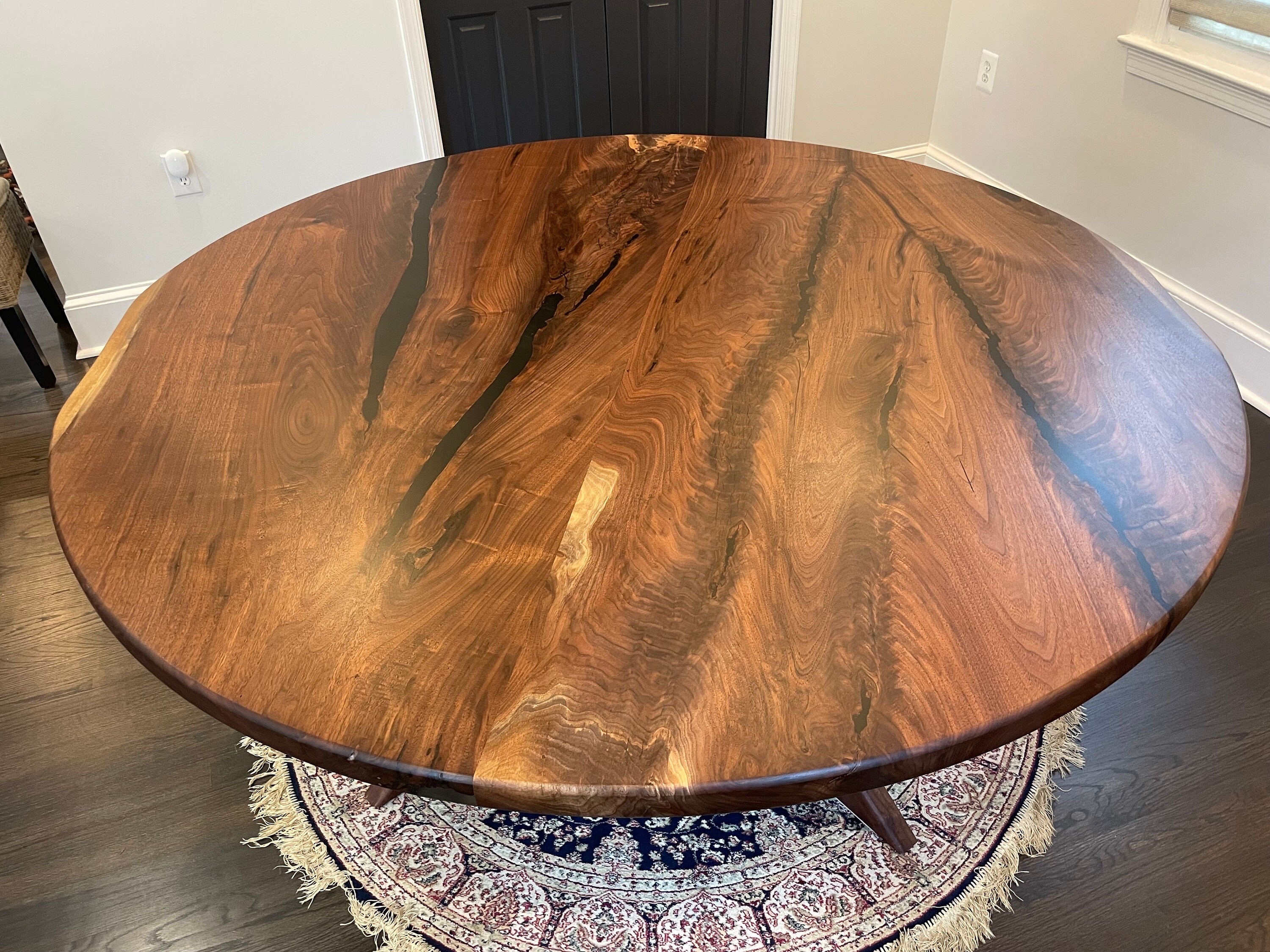 Black Resin Dining Table with Large Round Walnut Grain