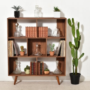 Bookshelf featuring Asymmetrical Grid and Tapered Leg Design
