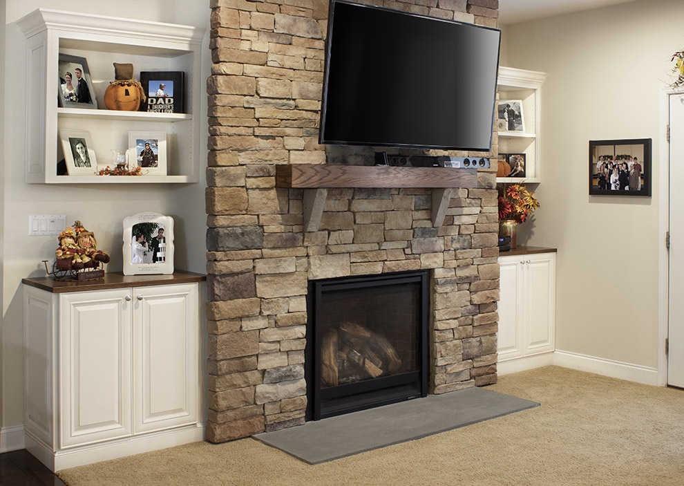 Built-In Cabinets with Stacked Stone Surround and Traditional Mantel