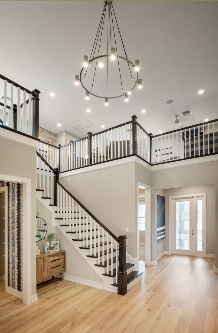 Chandelier Wagon Wheel Design Dark Wood Transitional Staircase Design