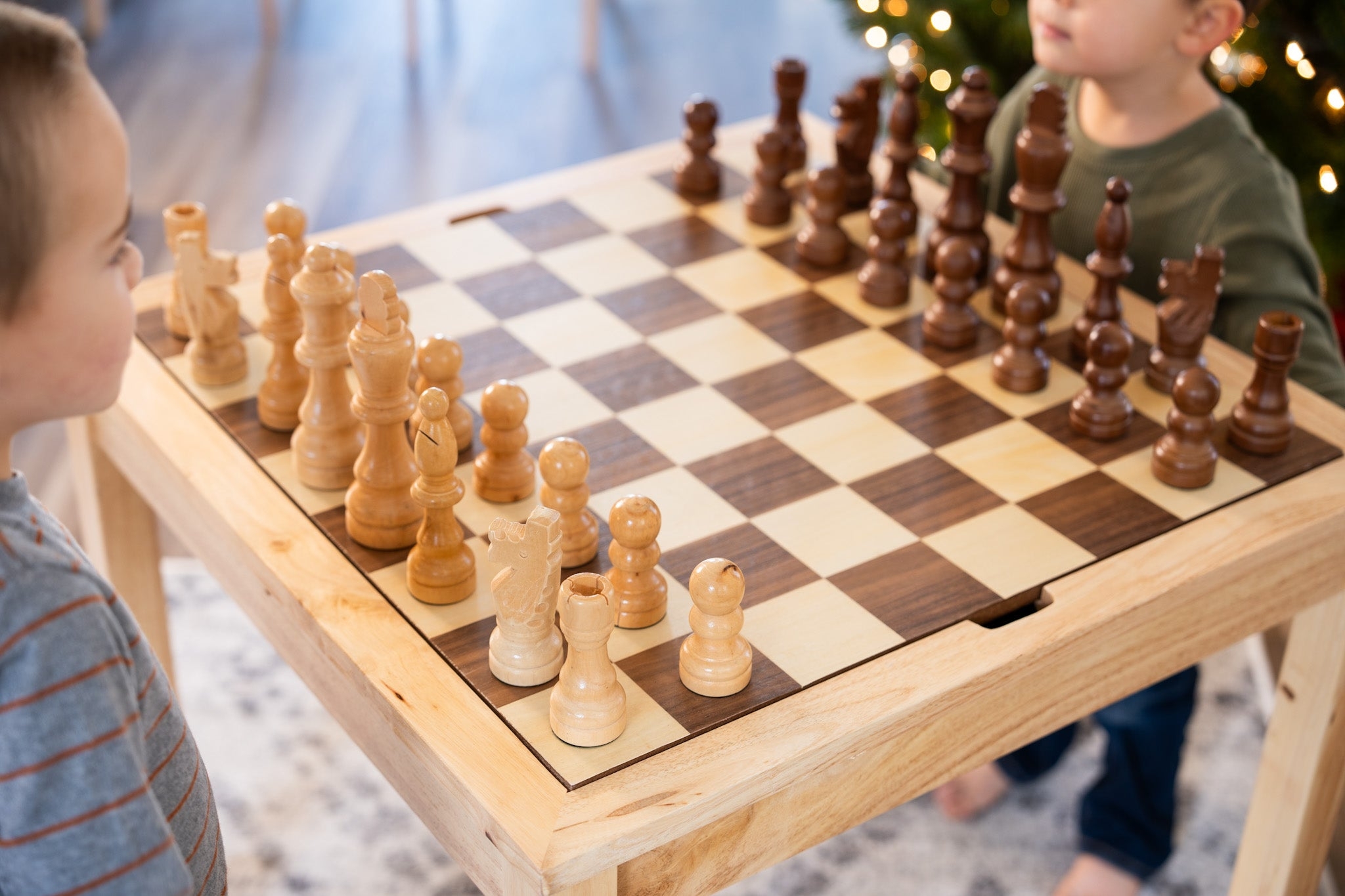 Chess Table Features Inset Board and Oversized Wood Pieces