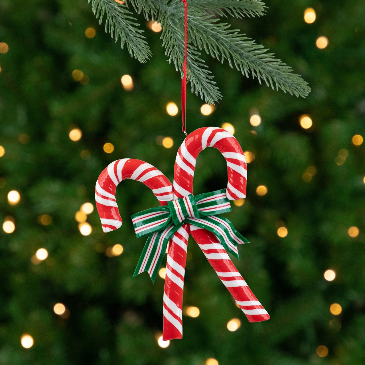 Christmas Ornament: Crossed Candy Canes and Striped Bow Accent