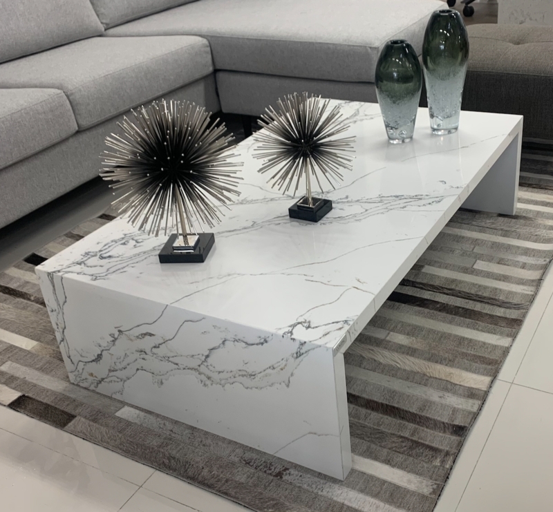 Coffee Table featuring Waterfall Edge in Veined Stone