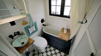 Compact Bathroom: Geometric Tile Mint Green Vessel Sink