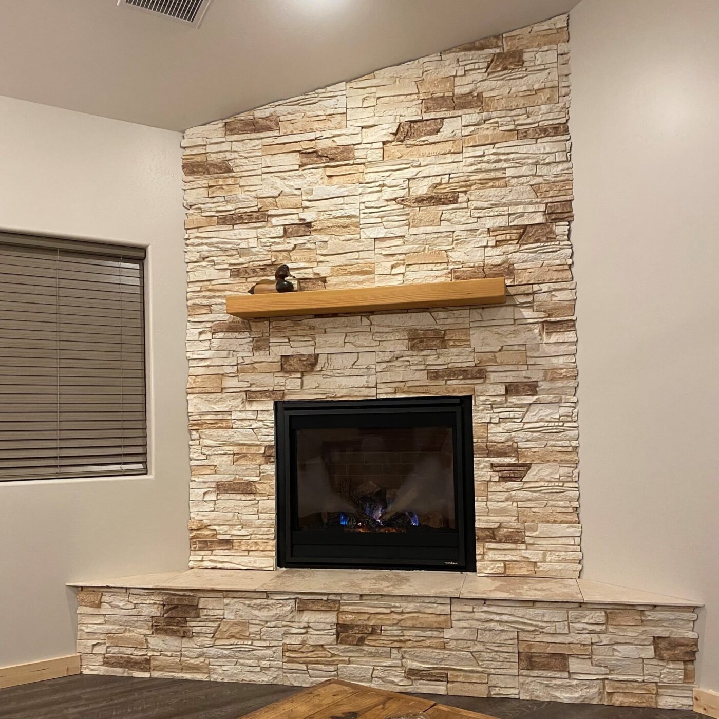 Corner Fireplace Slanted Top Edge and Corner Stone Design