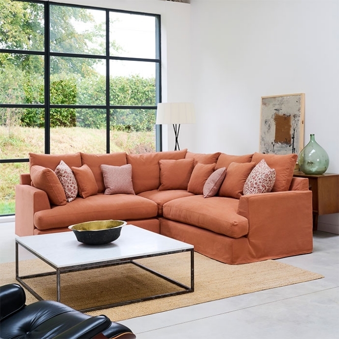 Corner Sofa: Skirted Base Design with Loose Back Cushions