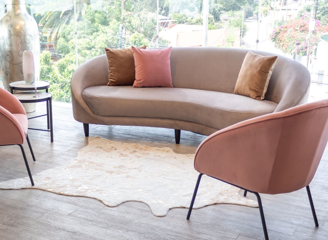 Curved Sofa: Dusty Rose Accents Taupe Velvet Seating Arrangement
