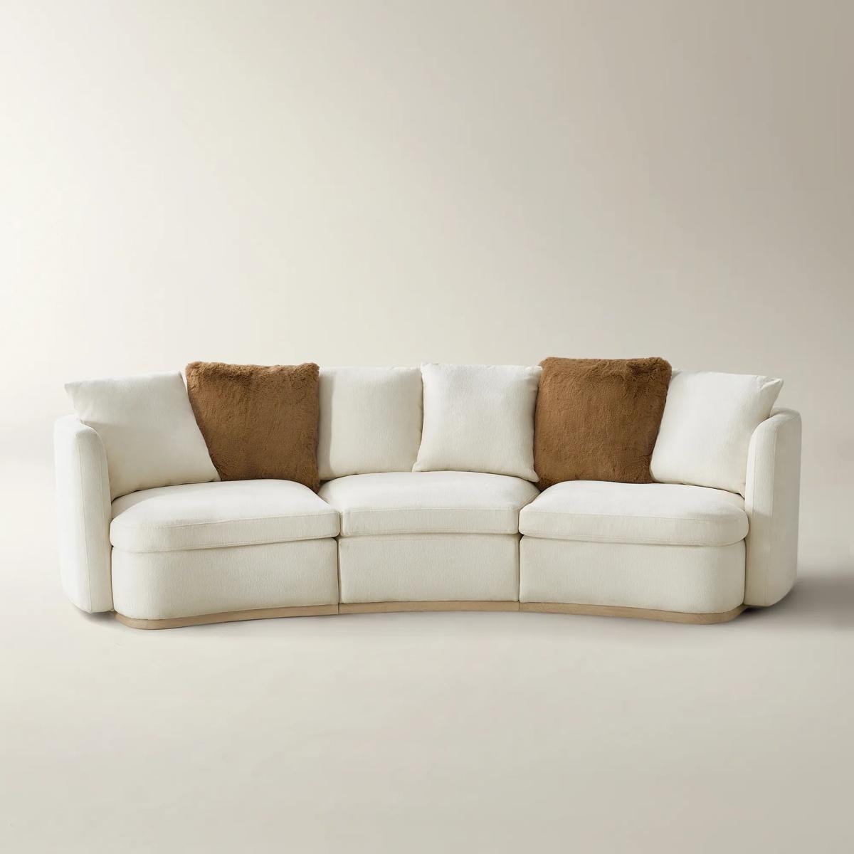 Curved Sofa Showcases Plinth Base and Modern Design