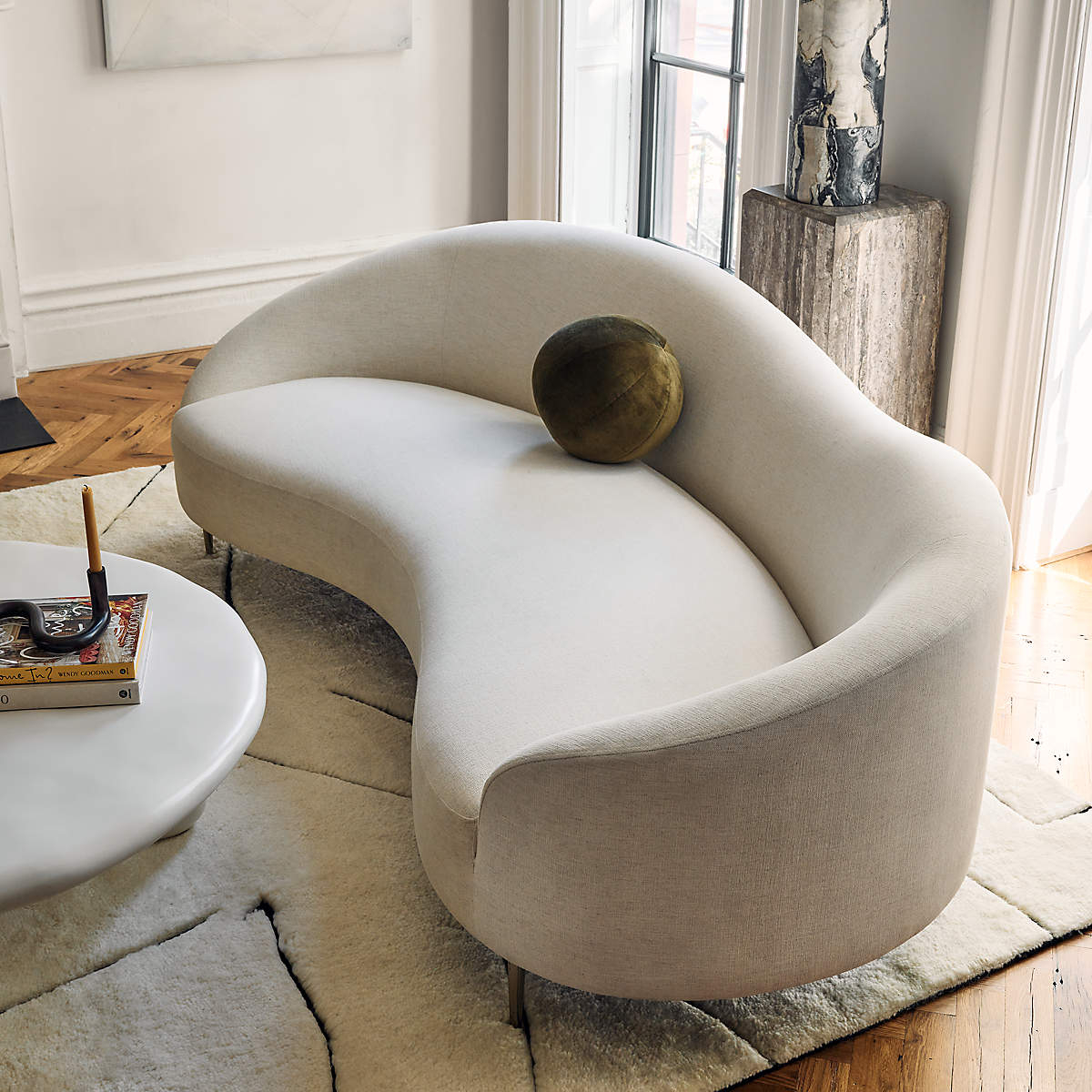 Curved Sofa with Asymmetrical Back and Sculptural Seating