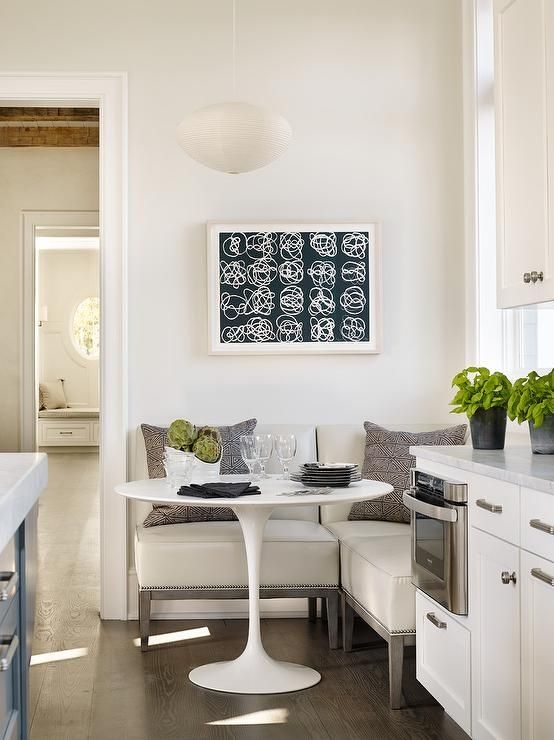 Dining Banquette: Nailhead Trim and Tulip Pedestal Table