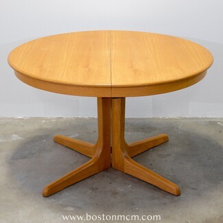 Dining Table with Four Pronged Pedestal and Oak Tone