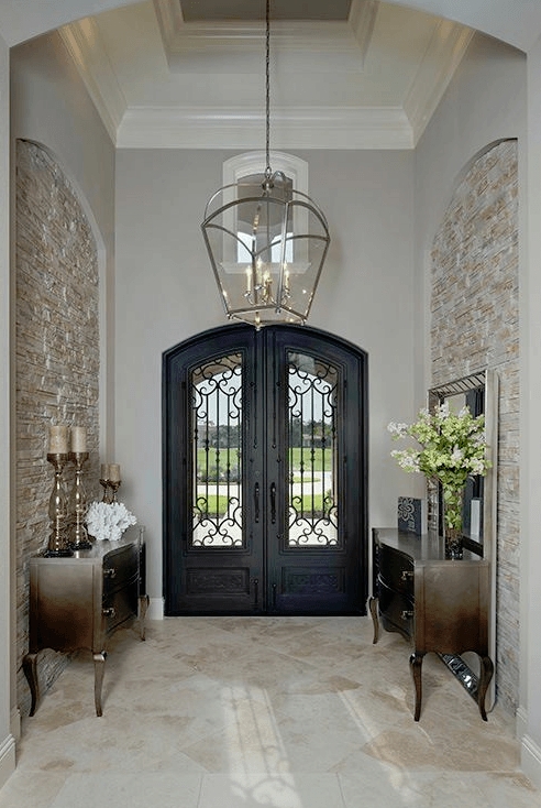 Entry Door Wrought Iron Scrollwork Arched Stone Niches