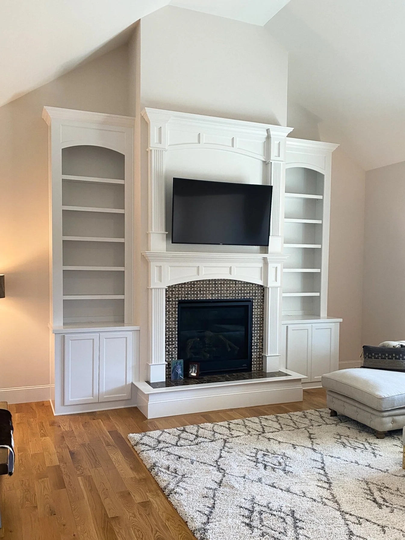 Fireplace Built-In with Arched Shelving and Fluted Column Details
