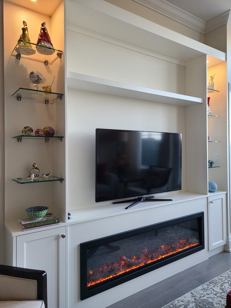Fireplace Wall Unit with Integrated Lighting and Modern Glass Shelves
