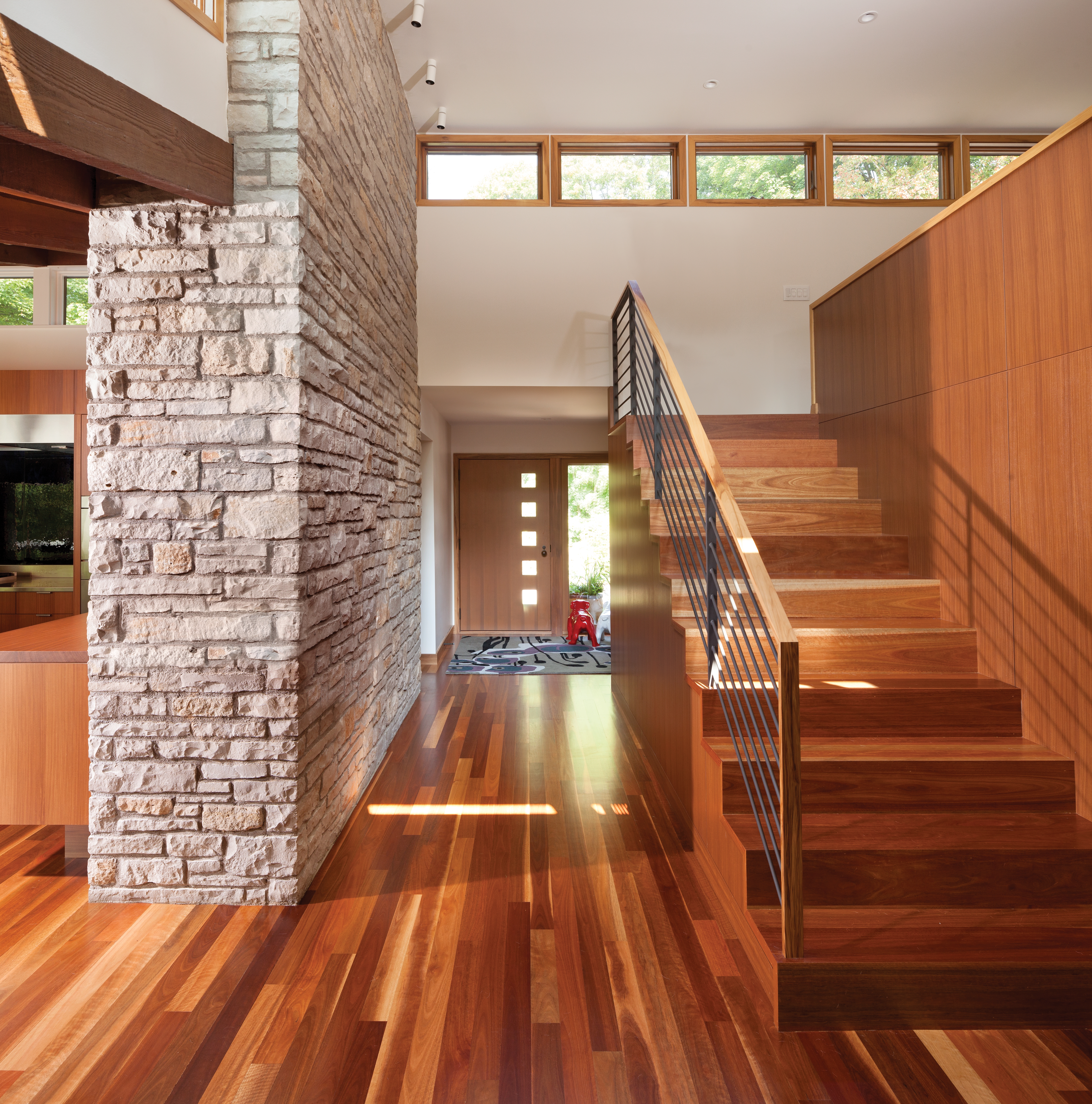 Foyer: Warm Wood Foyer Architecture with Cable Railing