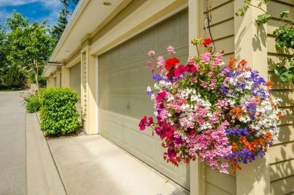 Garage Door Sectional Panels with Multi Color Blooms Hanging Baskets