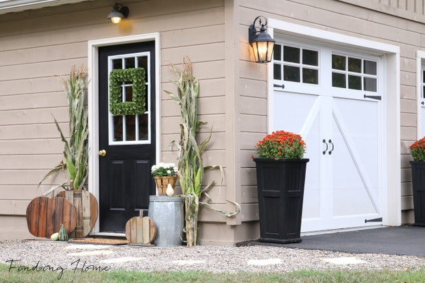 Garage Entry Farmhouse Makeover with Corn Stalks and Wooden Pumpkins