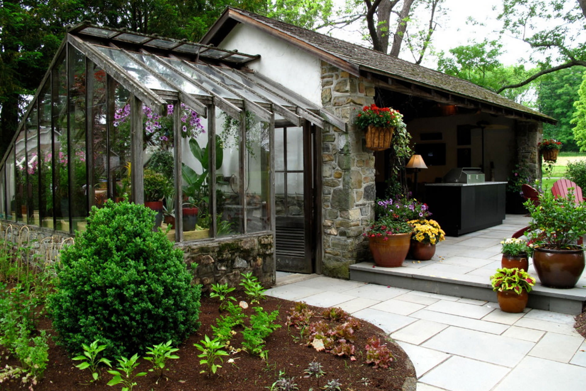 Garden Greenhouse Attached Glass Greenhouse and Stone Walls