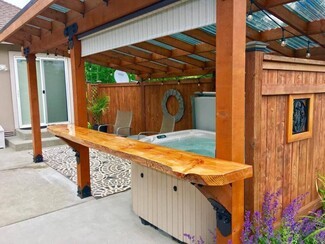 Gazebo with Live Edge Bar and Black Ornamental Hardware