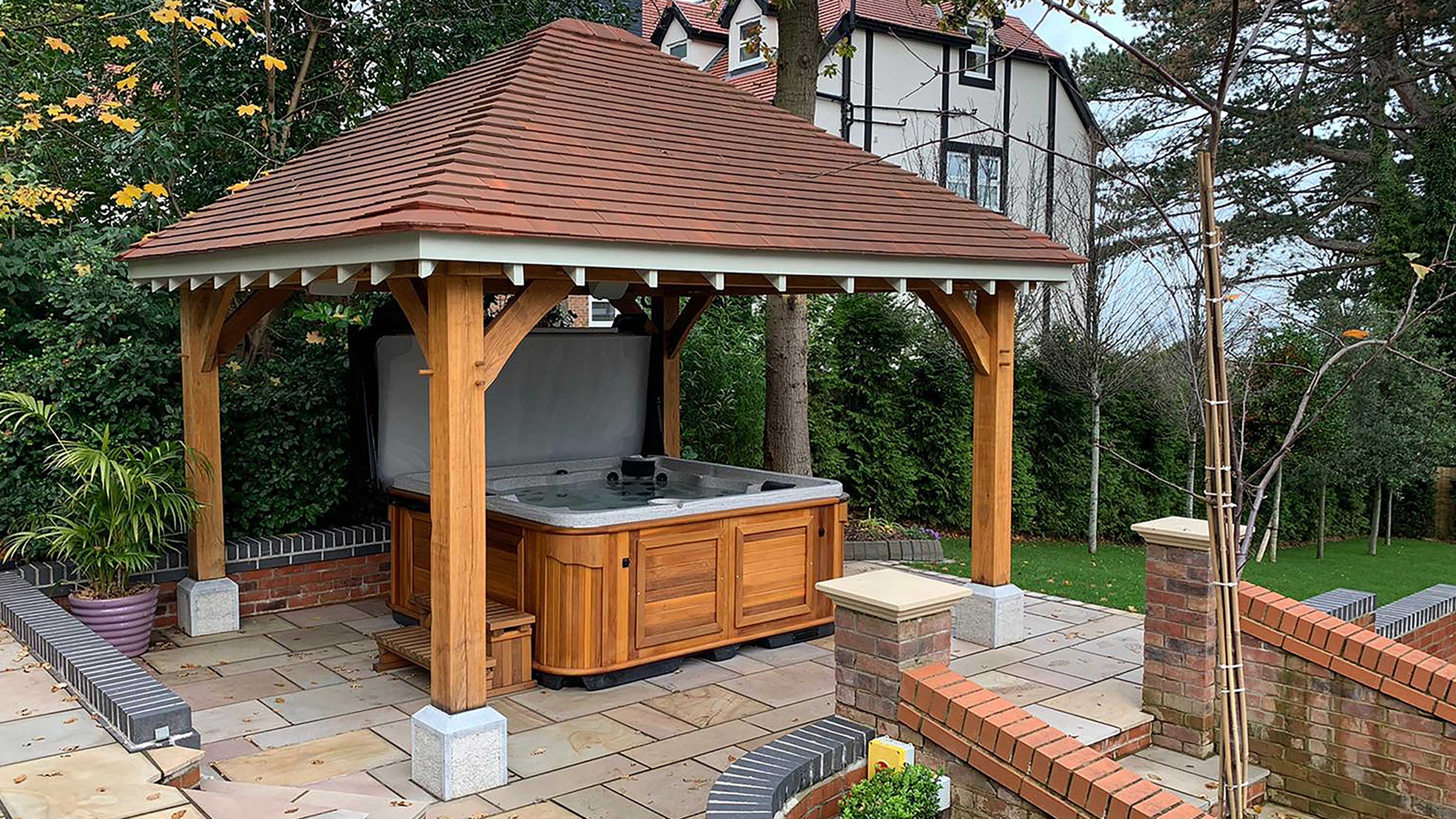 Hot Tub Gazebo with Hipped Tiled Roof and Stone Pedestals