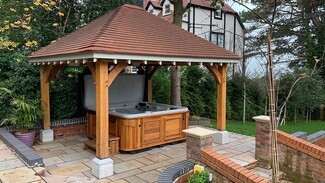 Hot Tub Gazebo with Hipped Tiled Roof and Stone Pedestals