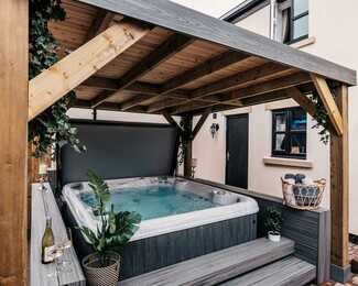 Hot Tub: Sloped Pergola Roof Integrated Bar Ledge Gray