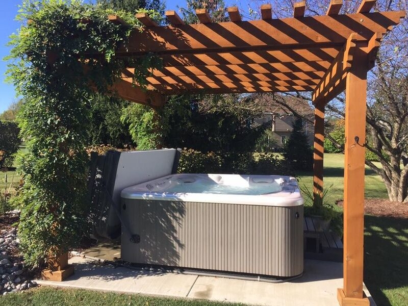 Hot Tub with Climbing Vine Privacy and Slatted Wood Roof
