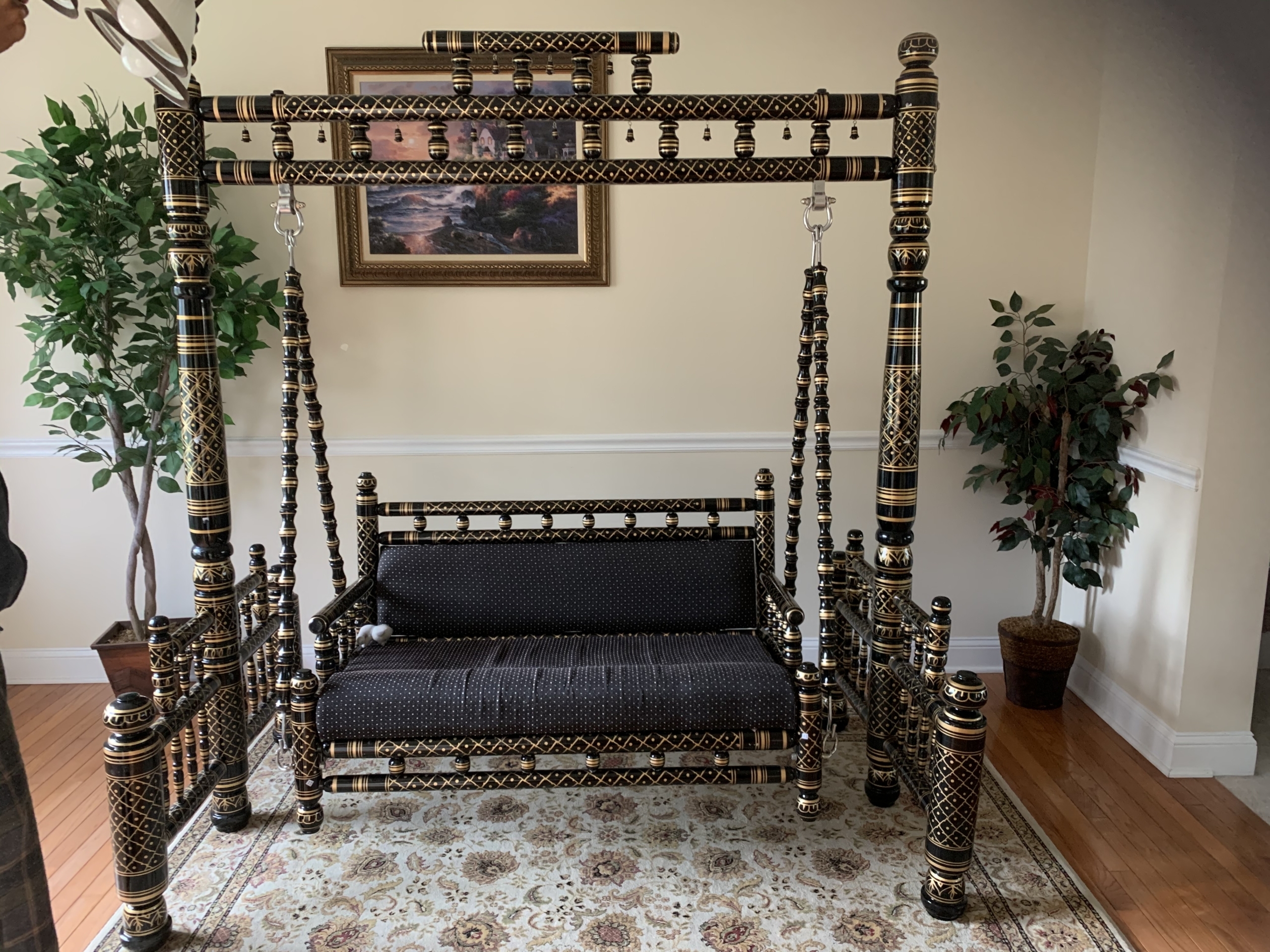 Indoor Swing Featuring Gold Etched Detailing and Frame