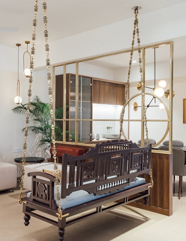Indoor Swing Having a Geometric Partition and Blue Seat