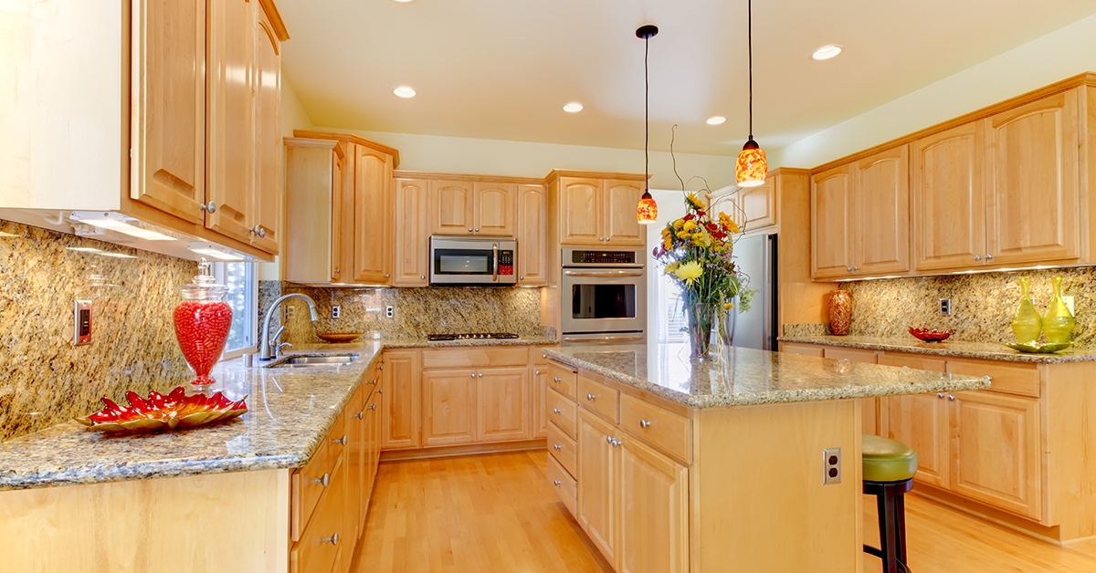 Kitchen Cabinetry: Amber Pendants Raised Panel Cabinetry Idea