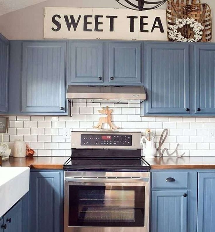 Kitchen Cabinetry: Dusty Blue Finish with Cup Pulls