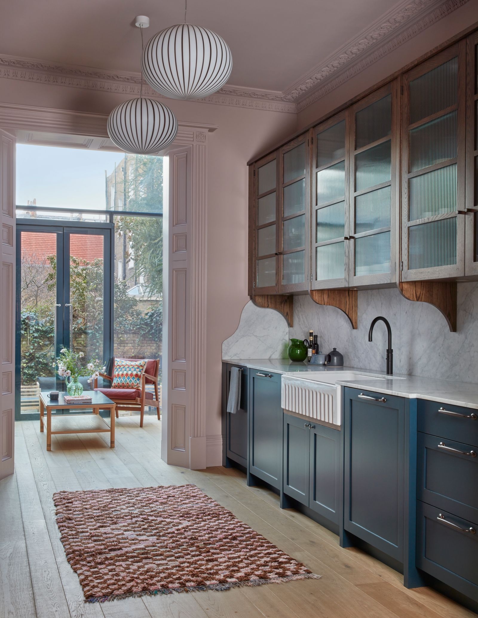 Kitchen Cabinetry in Navy Blue with Reeded Glass Doors